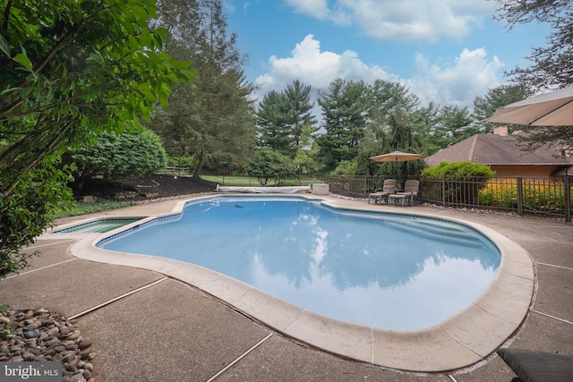 view of pool featuring a patio, fence, and a fenced in pool