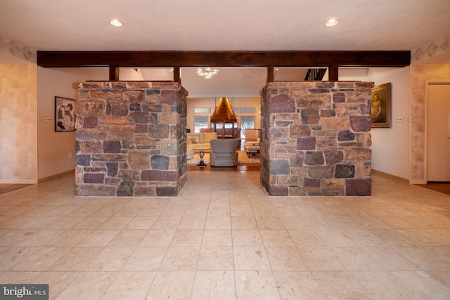 living room with baseboards, beam ceiling, and recessed lighting