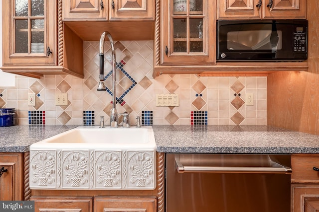 kitchen with black microwave, brown cabinets, and dishwasher