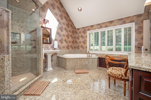 full bath with vaulted ceiling, a stall shower, a bath, and wallpapered walls