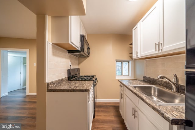 kitchen featuring white cabinetry, sink, and black appliances