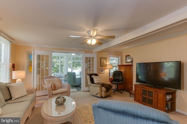 living room featuring crown molding, light colored carpet, and ceiling fan