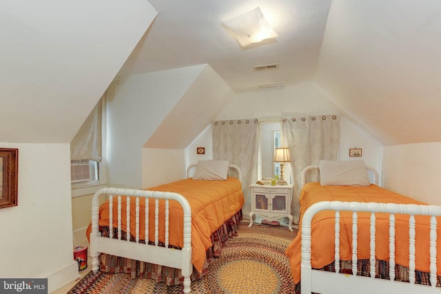 bedroom with vaulted ceiling, carpet floors, and cooling unit