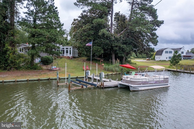 view of dock featuring a water view and a lawn