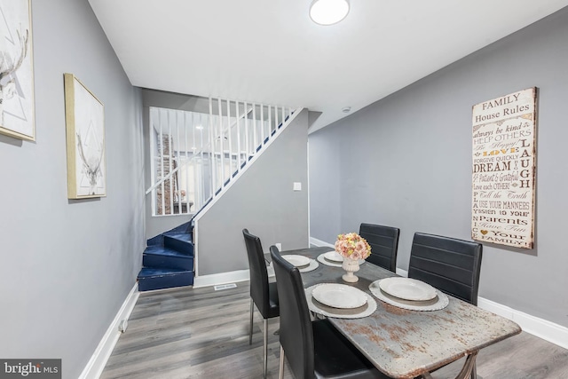 dining room with hardwood / wood-style floors