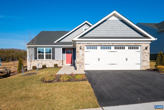 craftsman-style house with a garage and a front lawn