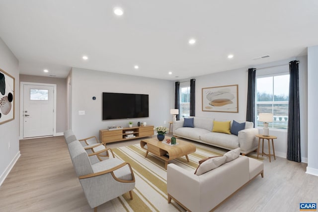 living room with light hardwood / wood-style floors