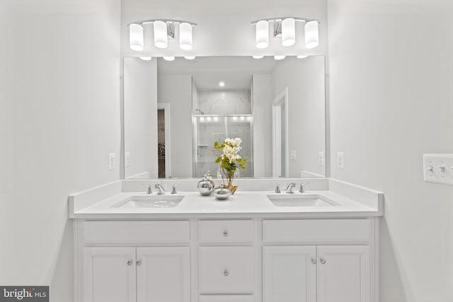 bathroom featuring vanity and an enclosed shower