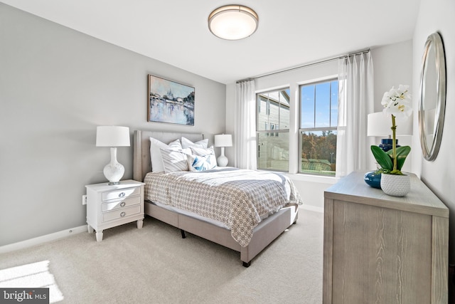 bedroom with light colored carpet