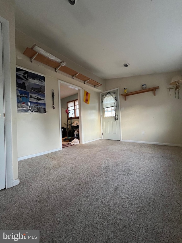 unfurnished room featuring carpet