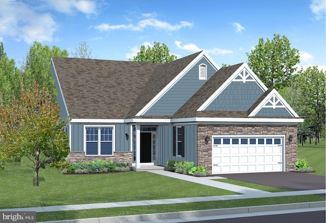 view of front of house featuring a garage and a front yard