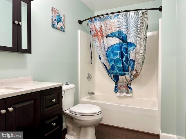 bathroom with toilet, shower / bathtub combination with curtain, wood finished floors, and vanity