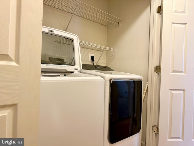 laundry room with laundry area and separate washer and dryer