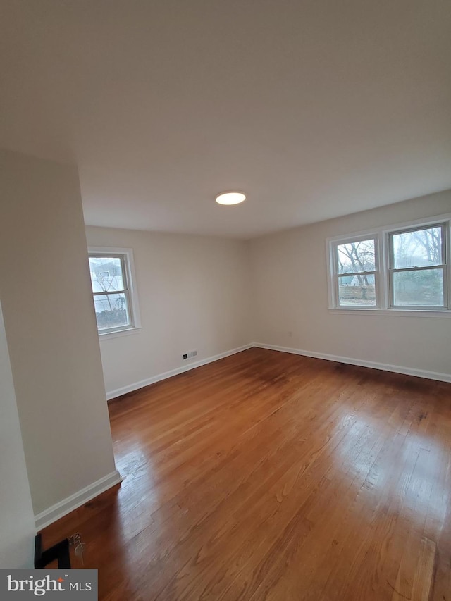 unfurnished room featuring wood-type flooring