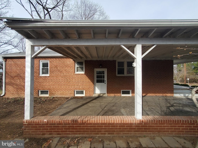 rear view of house with a carport