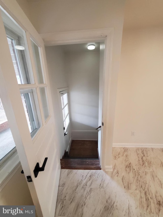 staircase with plenty of natural light