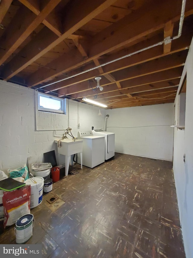 basement with independent washer and dryer and sink