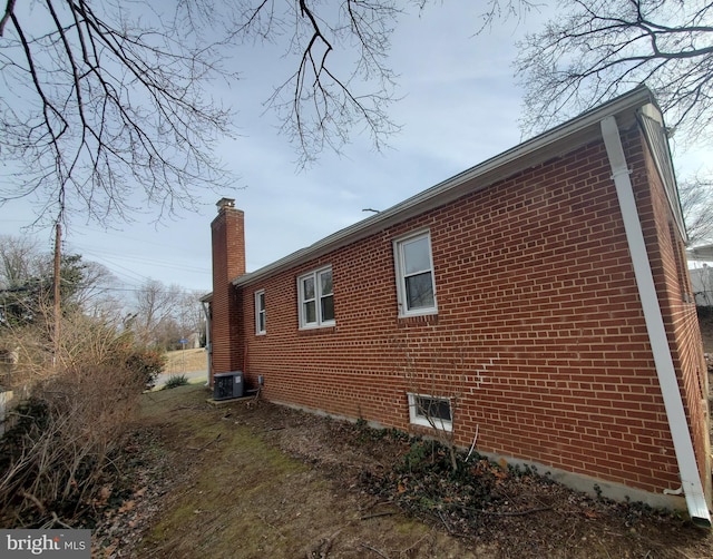 view of side of property featuring central AC unit