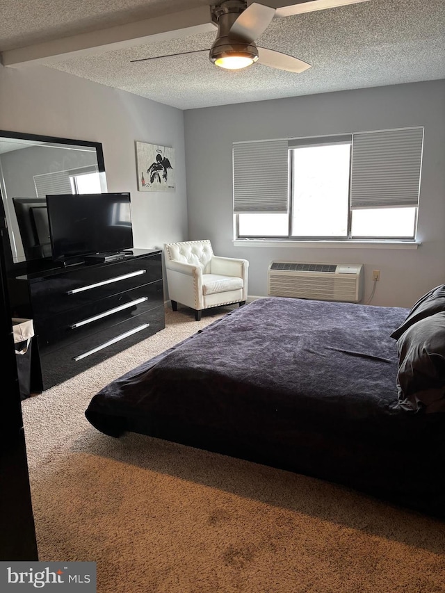 carpeted bedroom featuring a ceiling fan, a textured ceiling, and a wall mounted AC