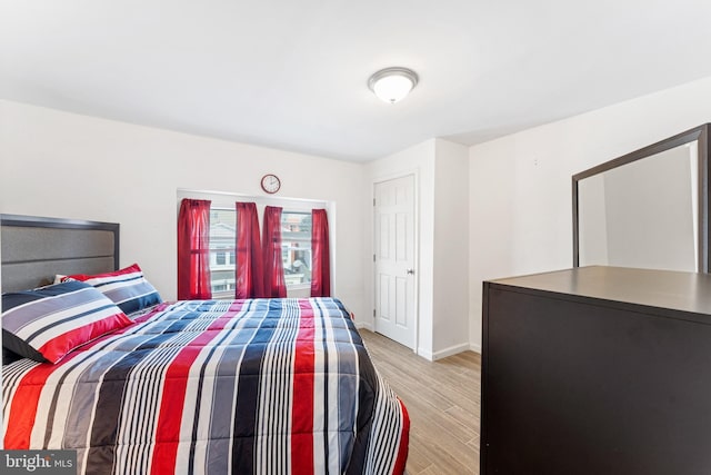 bedroom with light wood-type flooring