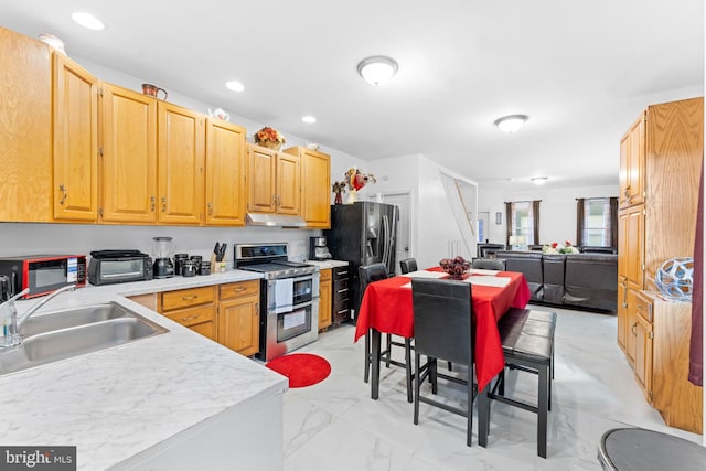 kitchen with appliances with stainless steel finishes and sink