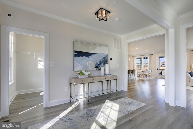 hall with crown molding and hardwood / wood-style floors