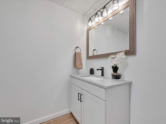 bathroom featuring vanity and hardwood / wood-style floors