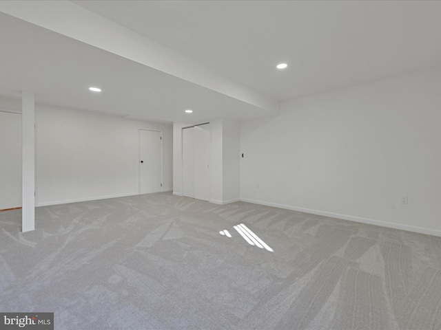 basement with light colored carpet