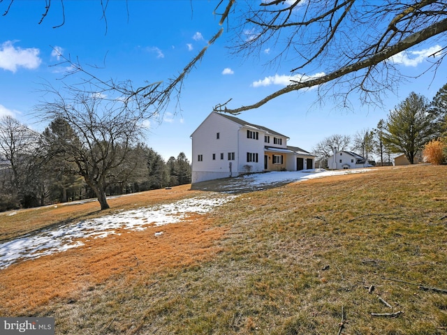 view of side of home featuring a yard