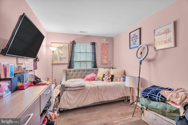 bedroom with light hardwood / wood-style flooring