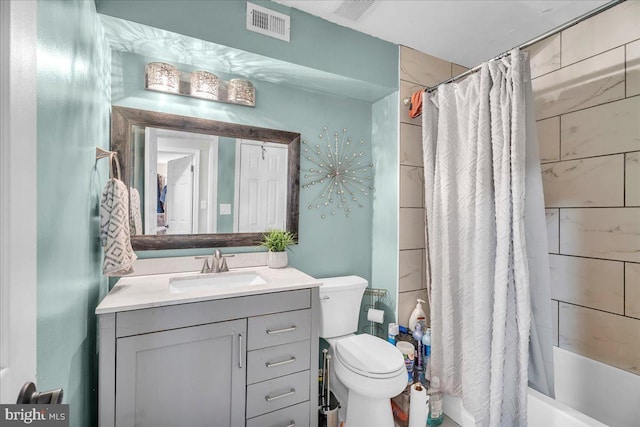 full bathroom with shower / bath combination with curtain, vanity, and toilet