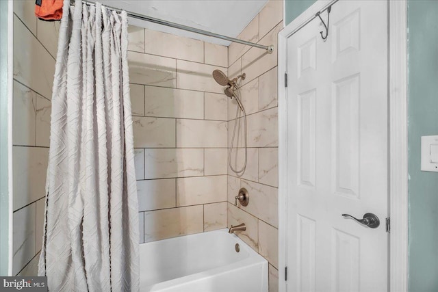 bathroom featuring shower / bathtub combination with curtain