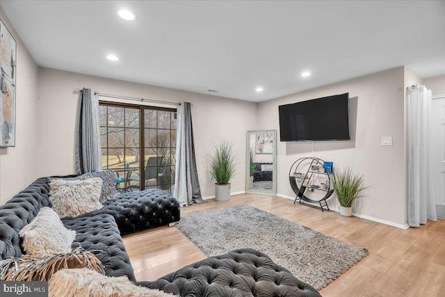 living room with light hardwood / wood-style floors