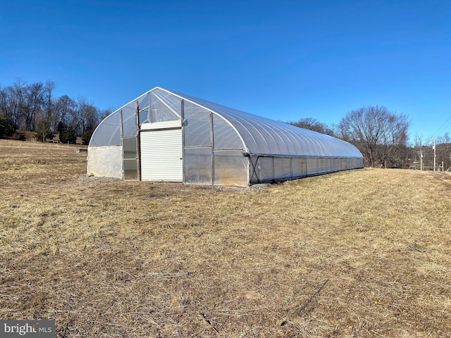 view of outbuilding with a lawn