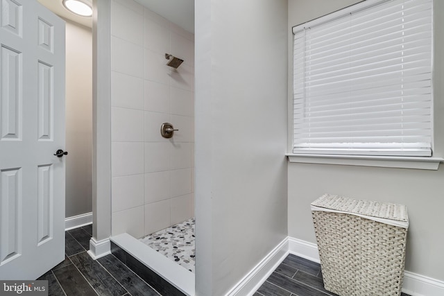 bathroom with a tile shower