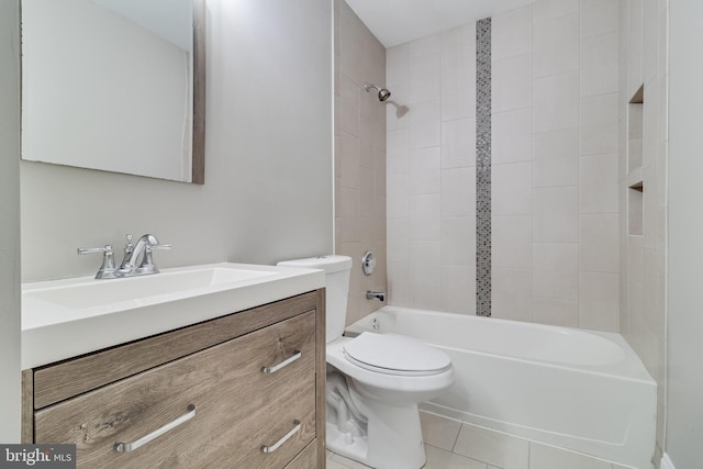 full bathroom featuring vanity, toilet, tiled shower / bath combo, and tile patterned flooring