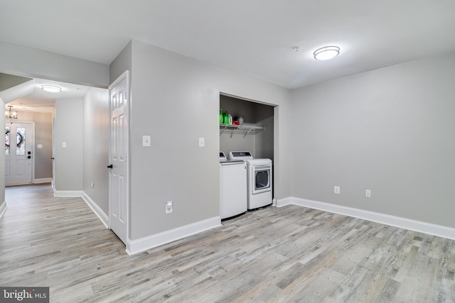 interior space with separate washer and dryer and light wood-type flooring