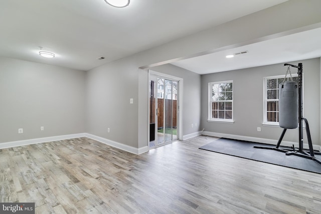 unfurnished room with light hardwood / wood-style floors