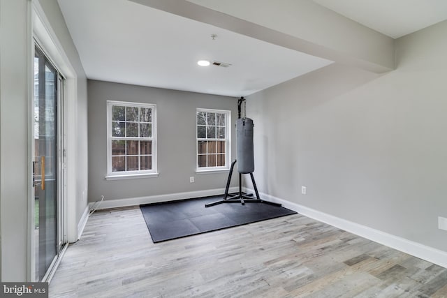 exercise area featuring light wood-type flooring