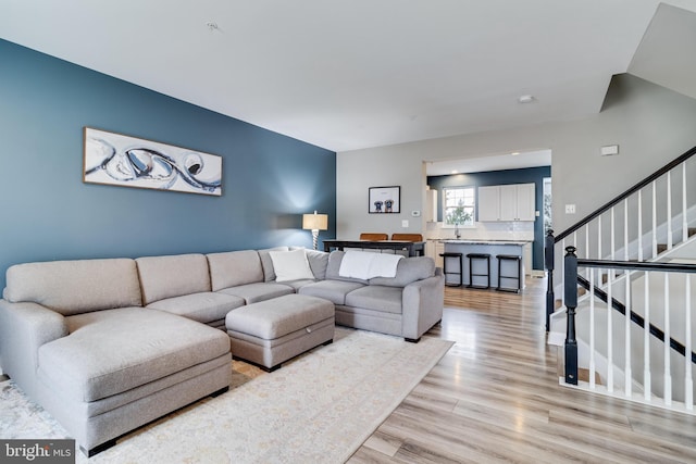 living room with light hardwood / wood-style flooring