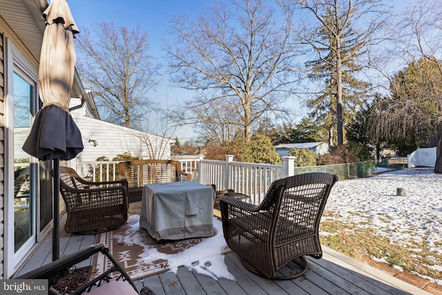 snow covered deck with grilling area