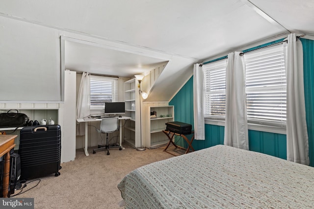 bedroom featuring lofted ceiling and light colored carpet