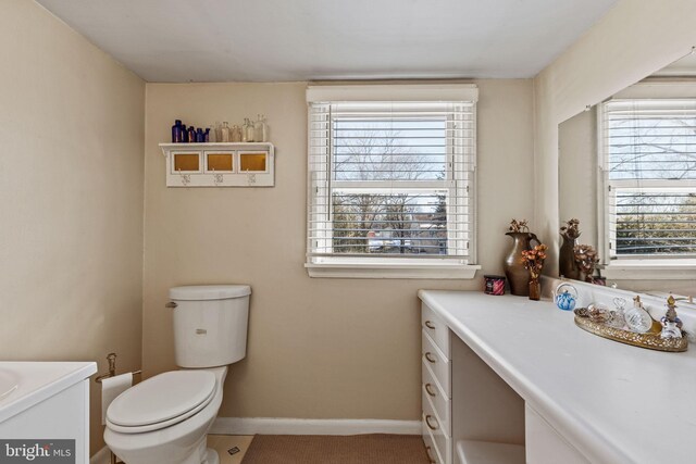 bathroom featuring vanity and toilet