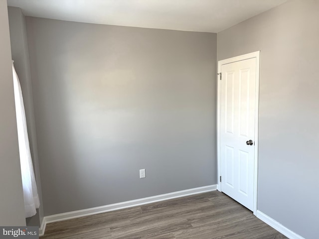 spare room featuring dark hardwood / wood-style flooring