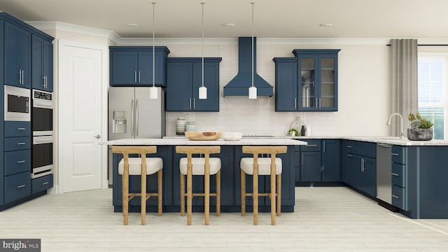 kitchen featuring sink, stainless steel appliances, ornamental molding, a kitchen bar, and wall chimney exhaust hood