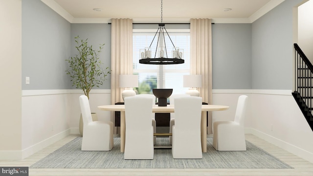 dining space with ornamental molding and wood-type flooring