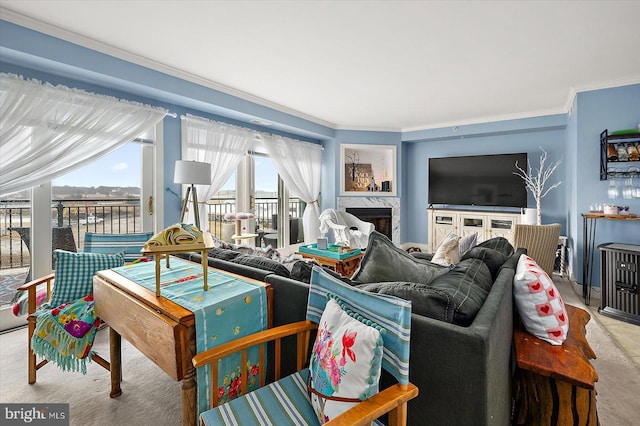 carpeted living room with ornamental molding and a healthy amount of sunlight