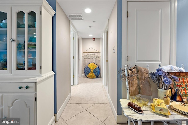 hallway featuring light tile patterned floors