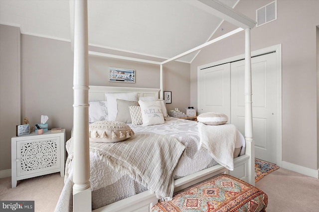 bedroom featuring lofted ceiling and carpet floors