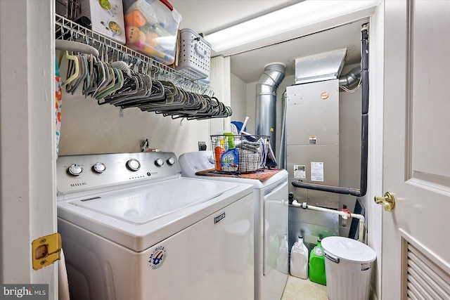 clothes washing area with washing machine and clothes dryer